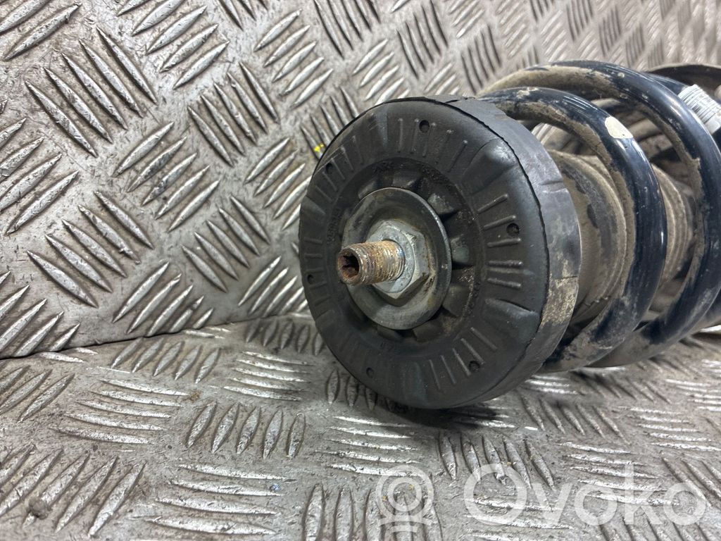 Opel Astra J Amortyzator osi przedniej ze sprężyną 