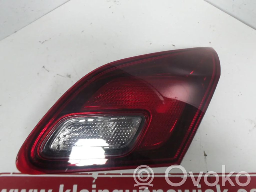 Opel Astra J Aizmugurējais lukturis virsbūvē 