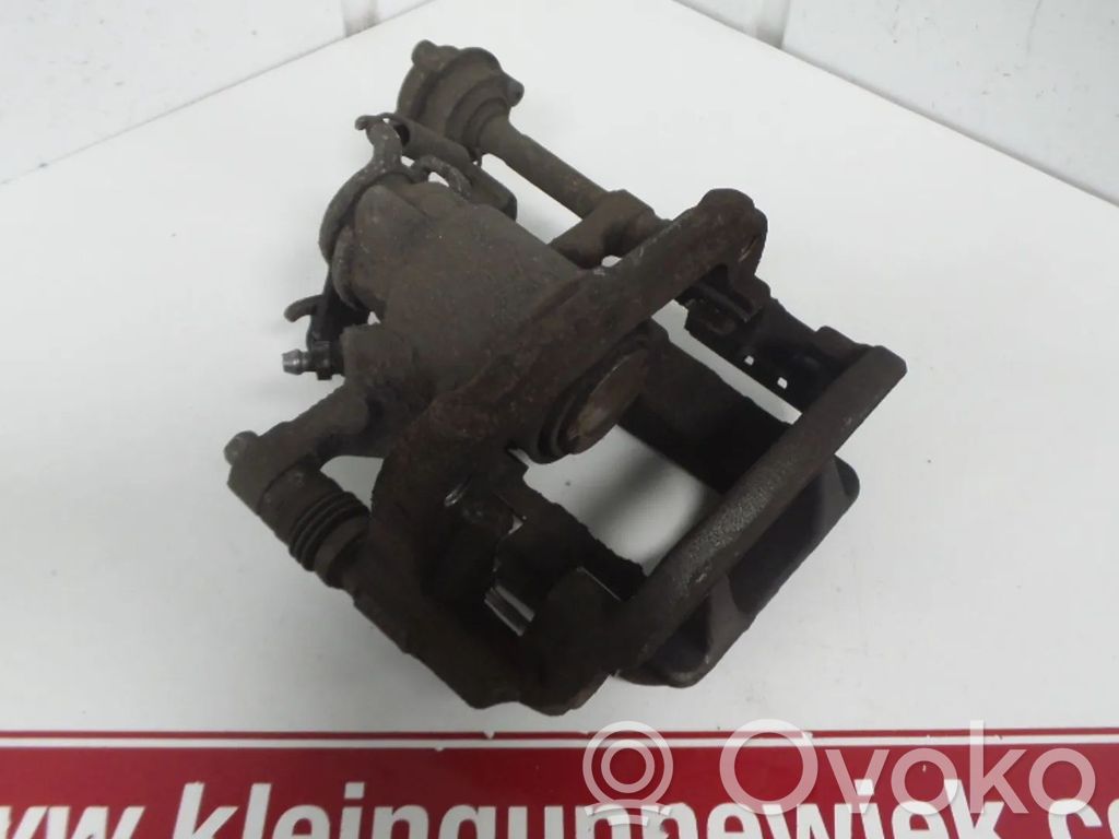 Opel Astra J Tylny zacisk hamulcowy 