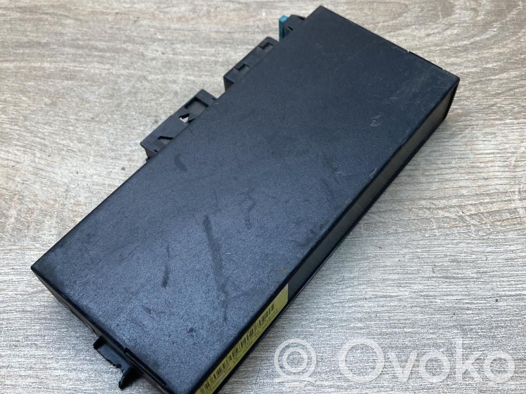 BMW 5 E34 Komforto modulis 