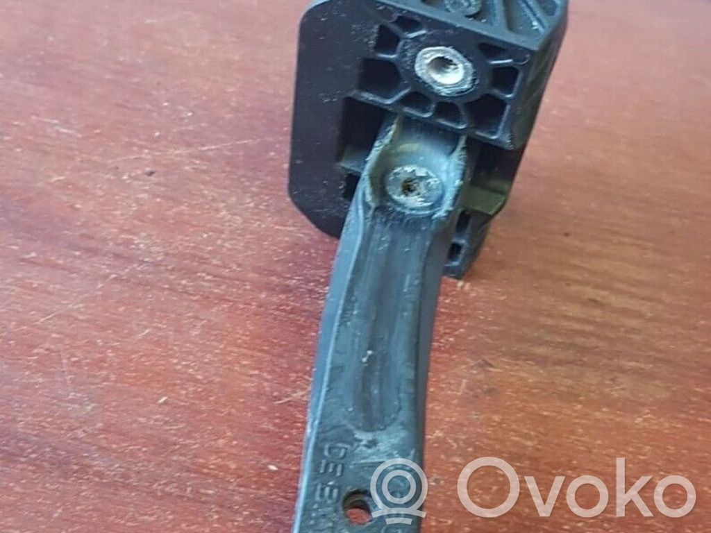 Front door check strap stopper   7176809