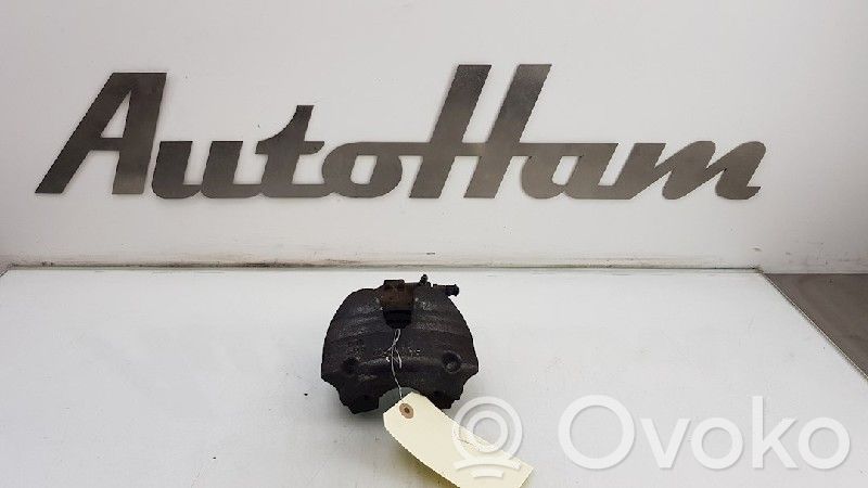 Opel Corsa E Zacisk hamulcowy przedni 