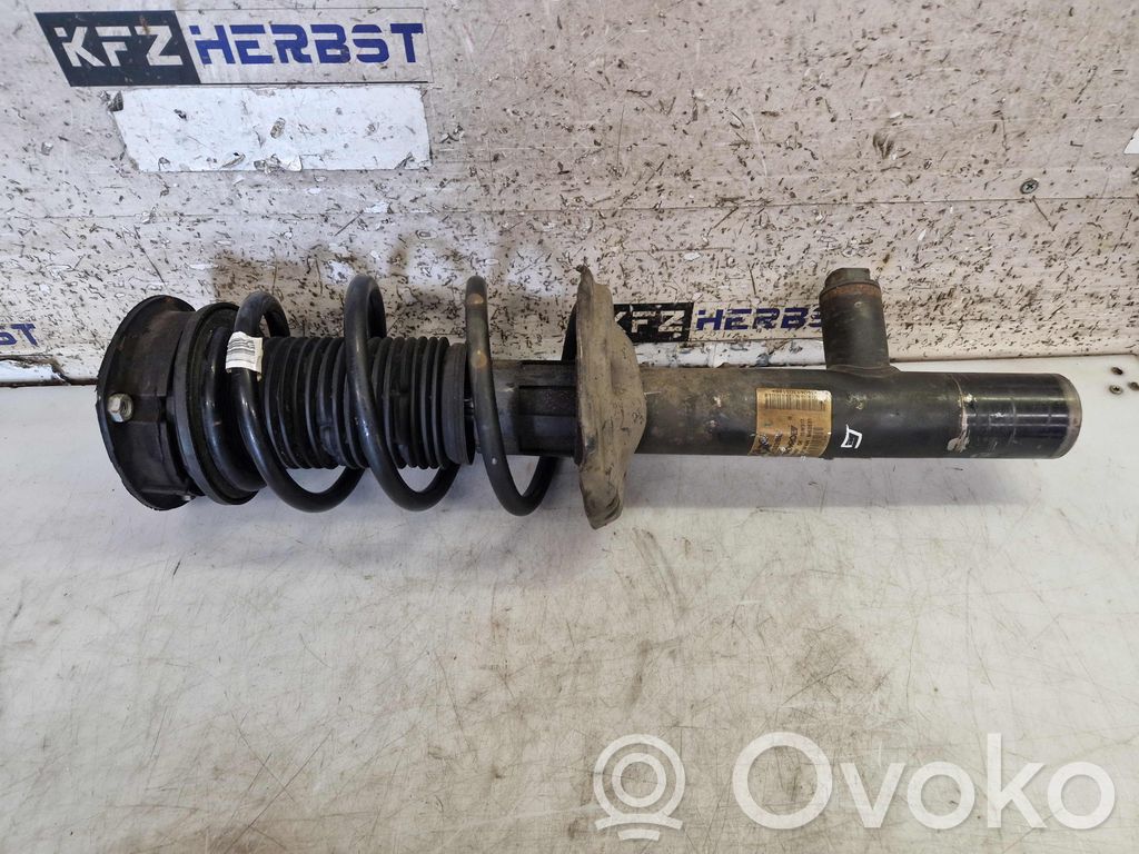 Volkswagen PASSAT B8 Amortyzator osi przedniej ze sprężyną 