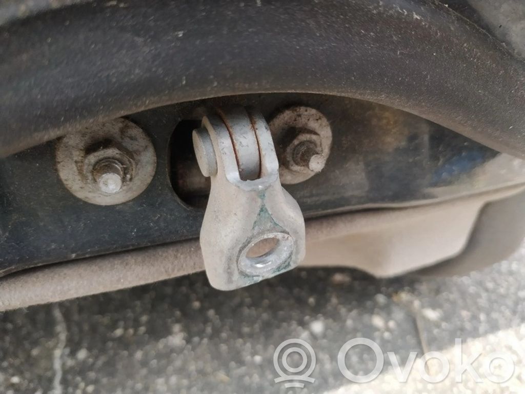 Front door check strap stopper