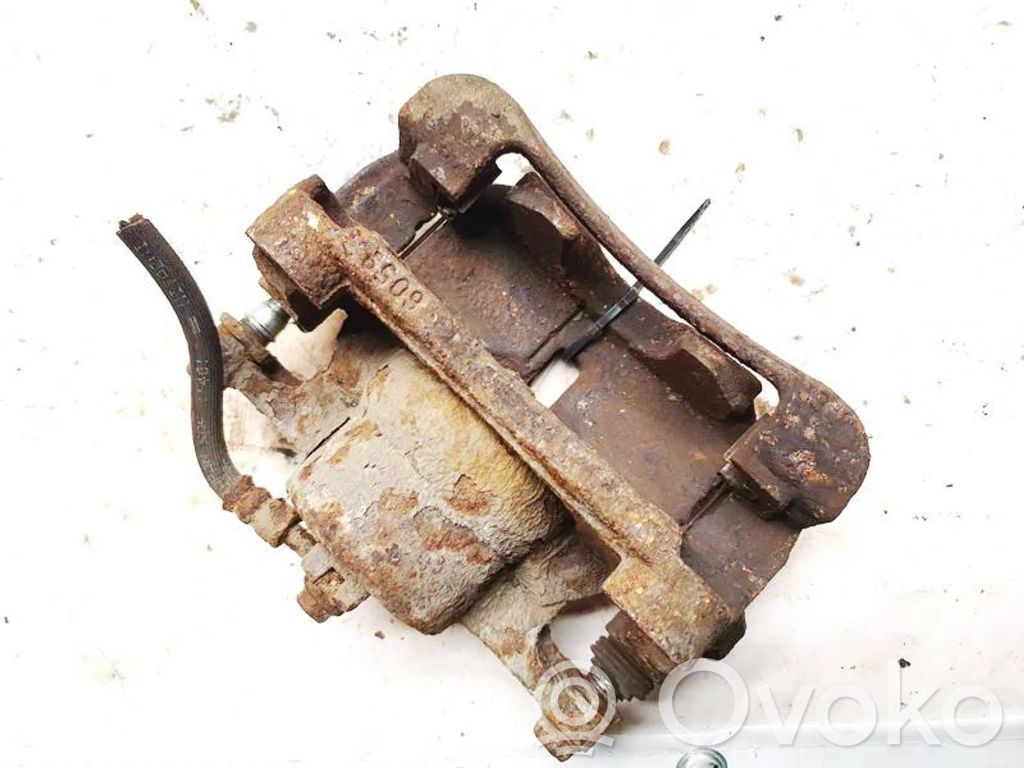 Nissan Qashqai Zacisk hamulcowy przedni