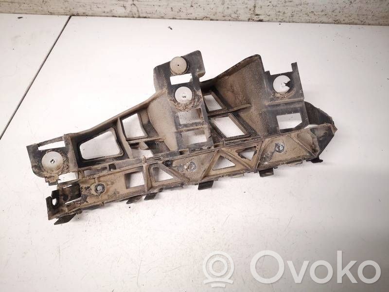 Opel Astra H Uchwyt / Mocowanie zderzaka tylnego 
