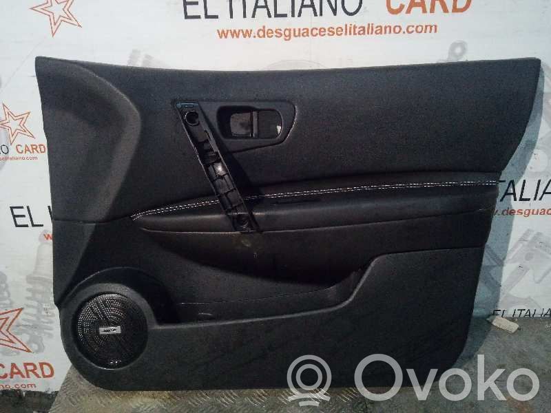 Nissan Qashqai+2 Garniture de panneau carte de porte avant 