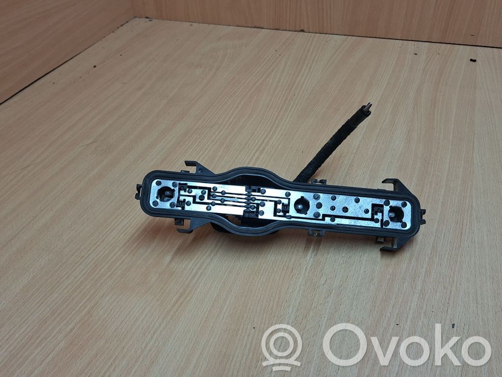 Renault Espace IV Aizmugures spuldzes vāka turētājs 