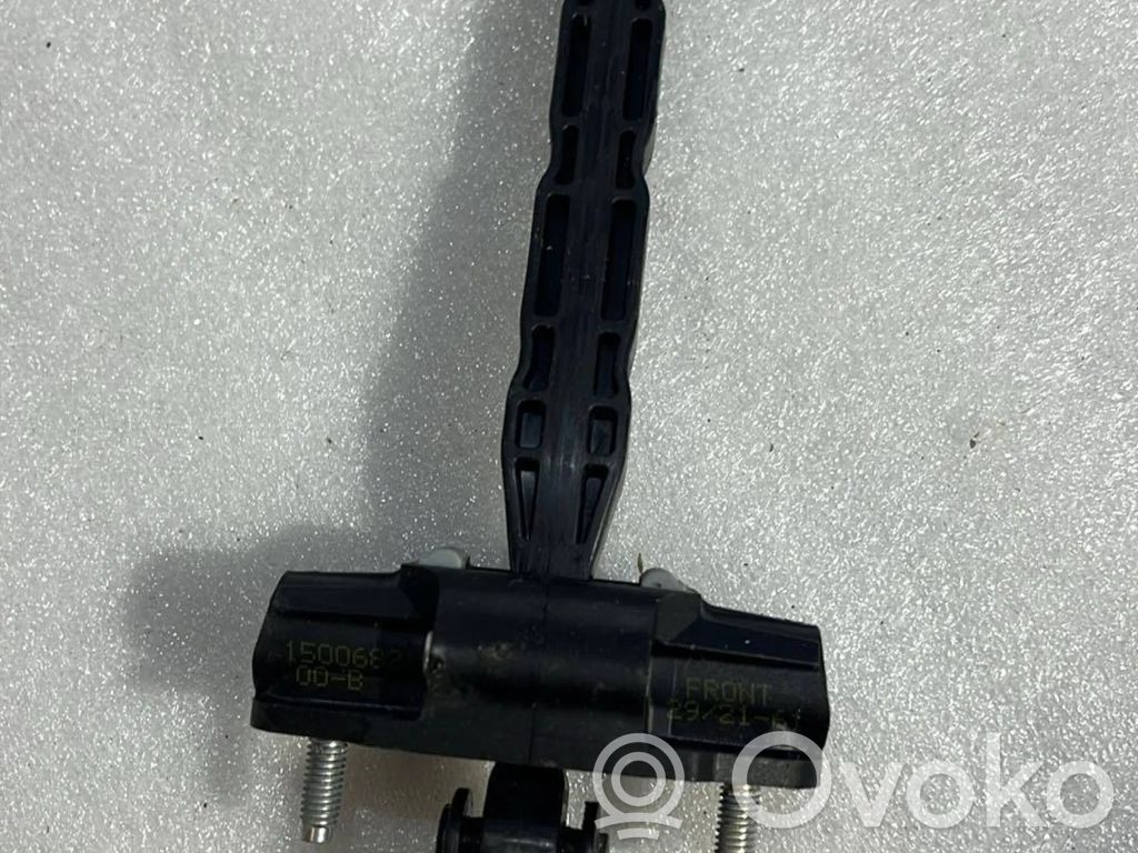 Front door check strap stopper