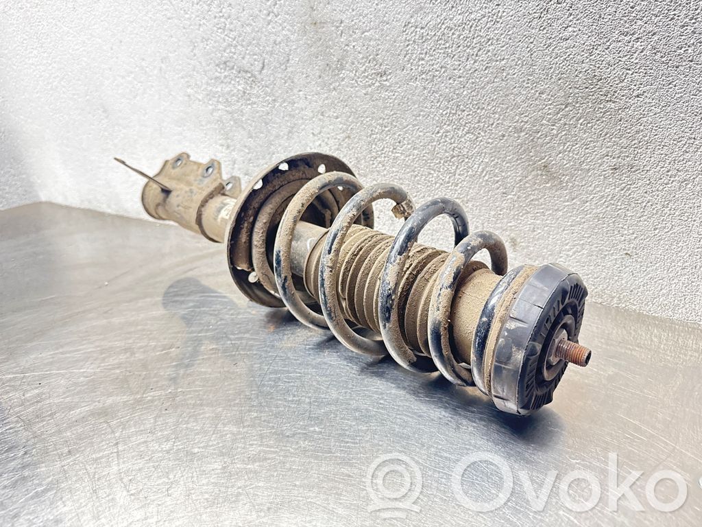 Opel Astra J Amortyzator osi przedniej ze sprężyną 