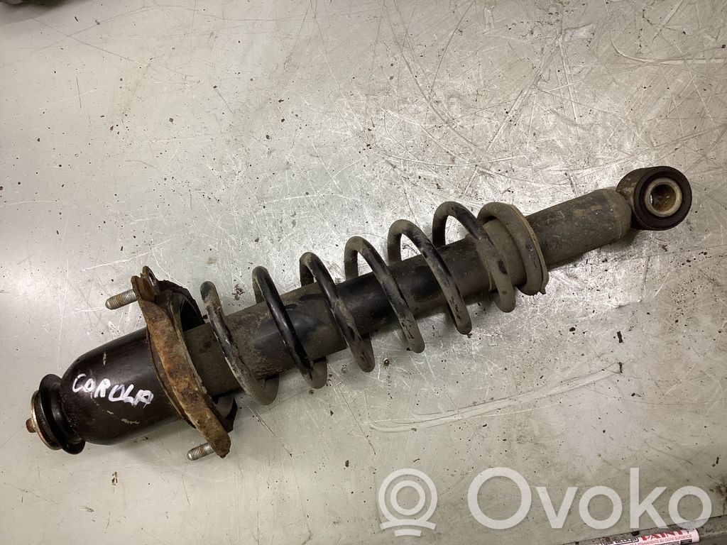 Toyota Corolla E120 E130 Galinis amortizatorius su spyruokle 
