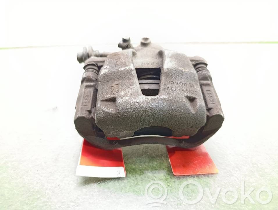 Opel Corsa D Zacisk hamulcowy przedni