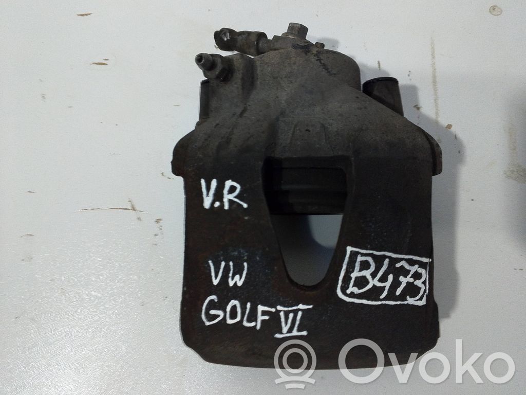 Volkswagen Golf V Zacisk hamulcowy przedni 