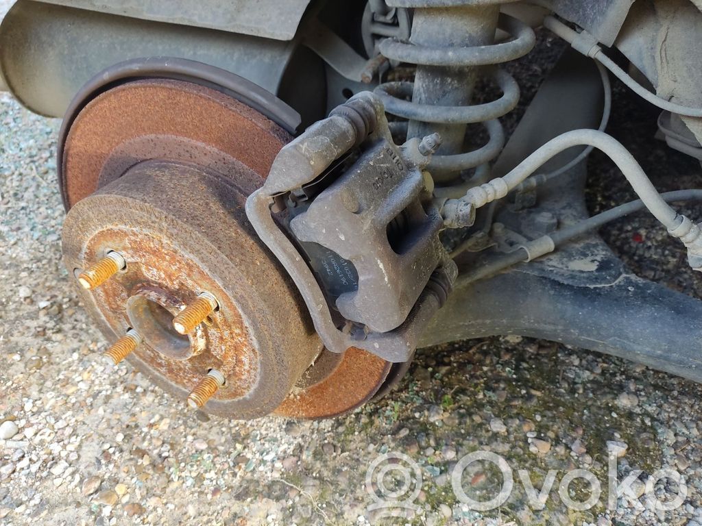 Toyota Corolla Verso E121 Mocowanie / Zacisk hamulca tylnego 