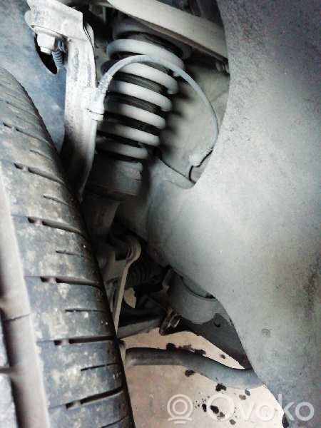 Volkswagen Touareg I Etuiskunvaimennin kierrejousella 