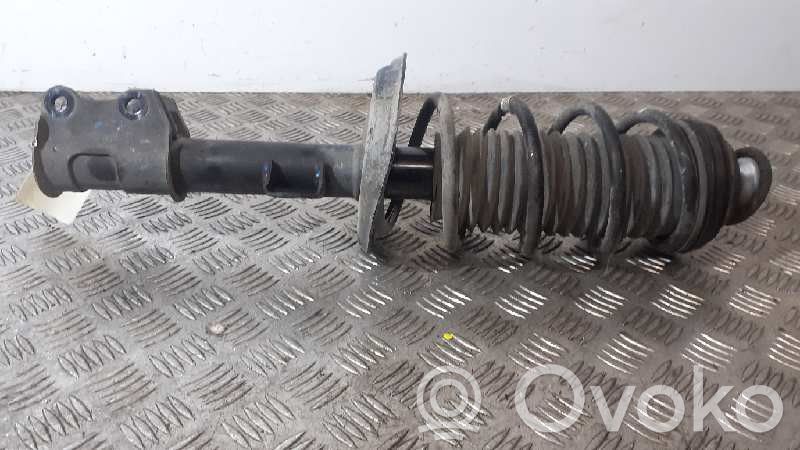 Opel Corsa D Etuiskunvaimennin kierrejousella