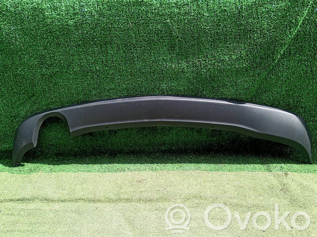Opel Astra J Moldura inferior del parachoques trasero 