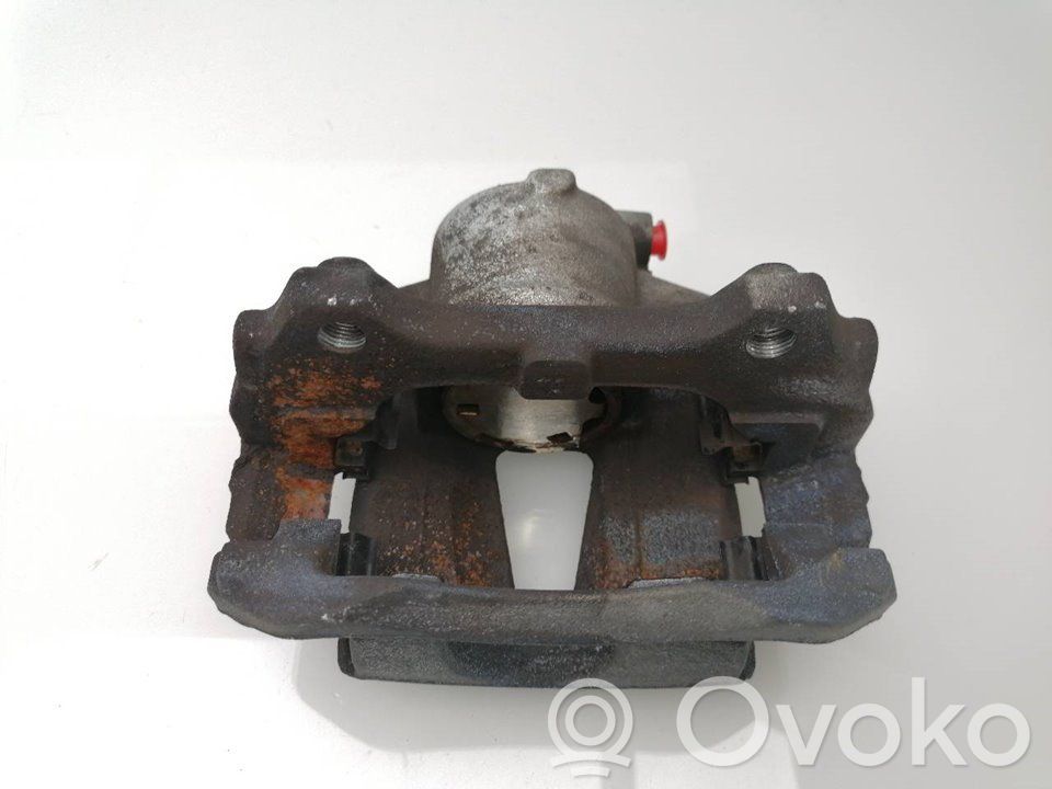 Opel Corsa D Zacisk hamulcowy przedni 