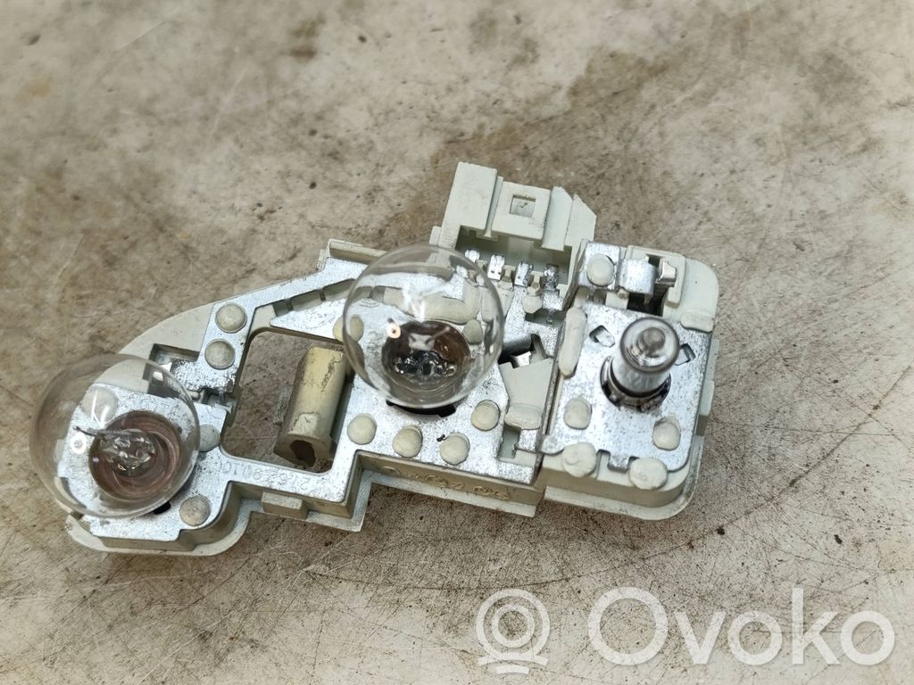 Tail light bulb cover holder   7160077