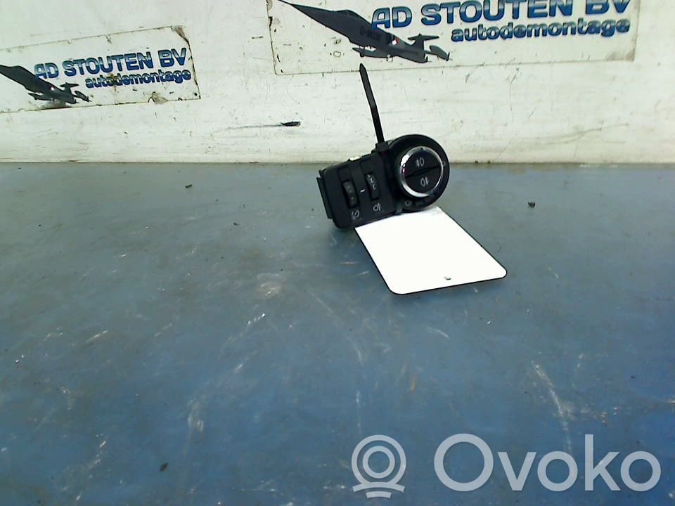 Opel Astra J Interruptor de control de altura del faro delantero 