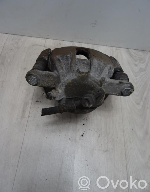 Nissan Micra C+C Zacisk hamulcowy przedni