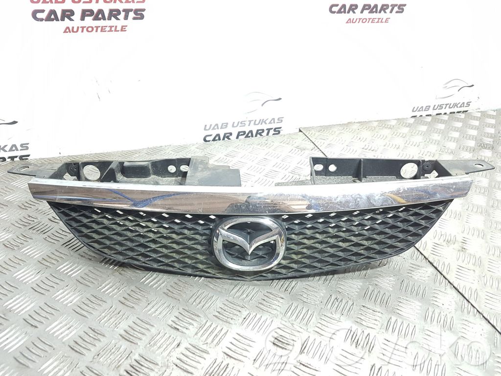 Mazda 323 Front bumper upper radiator grill 