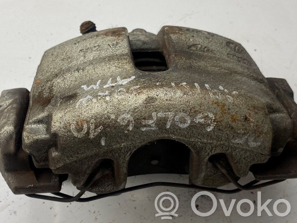 Volkswagen Golf VI Zacisk hamulcowy przedni 