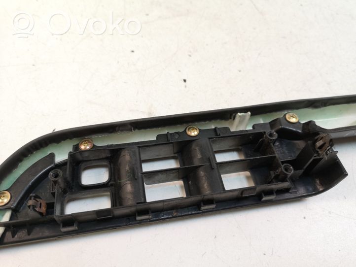 Nissan X-Trail T30 Front door window switch trim 80948EQ300