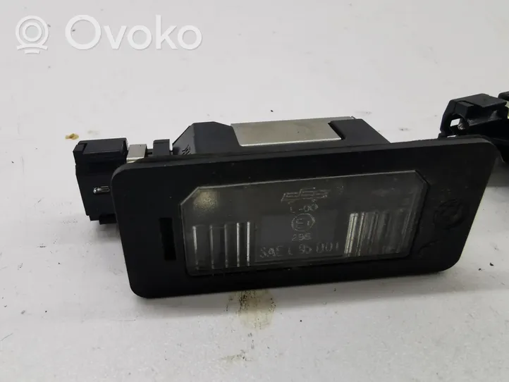 BMW X5 E70 Lampa oświetlenia tylnej tablicy rejestracyjnej 7176934