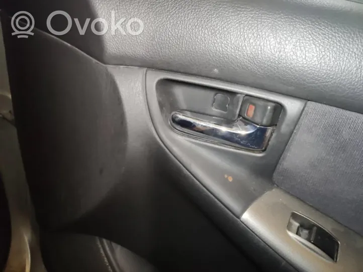 Toyota Corolla E120 E130 Klamka wewnętrzna drzwi 