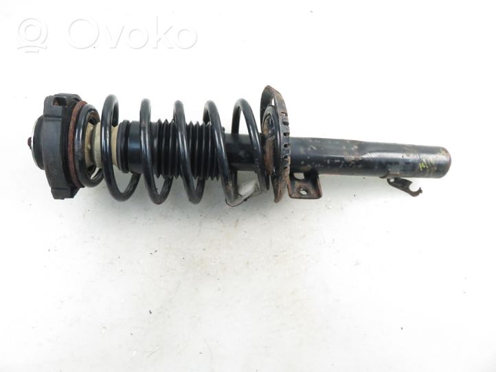Hyundai Solaris I Front shock absorber with coil spring 