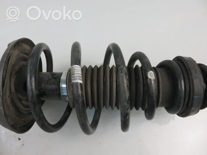 Opel Astra J Front shock absorber with coil spring 