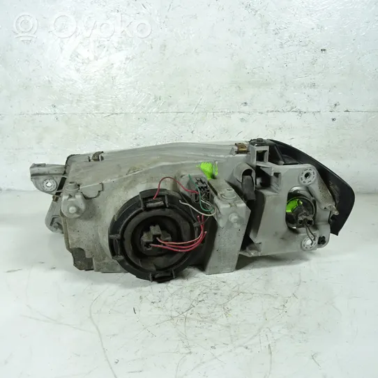 Mazda 323 Lampa przednia 1305235393