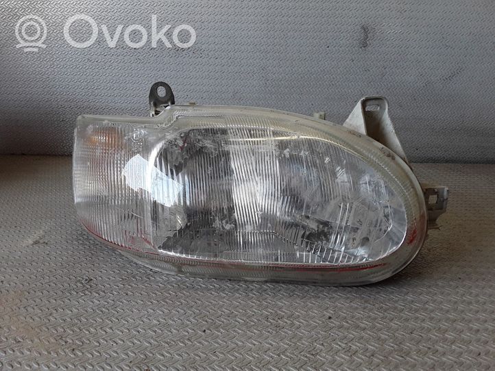 Ford Escort Lampa przednia 95AG13W029DD