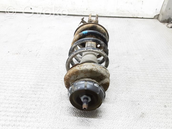 Dacia Logan I Front shock absorber with coil spring 