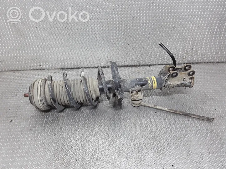 Opel Corsa D Front shock absorber with coil spring 