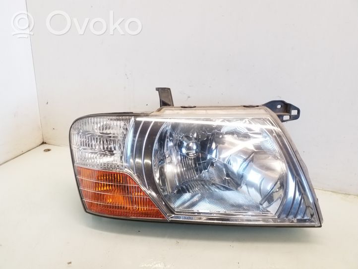 Mitsubishi Pajero Lampa przednia E131259652