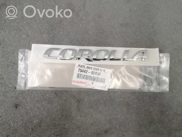 Toyota Corolla E210 E21 Ražotāja plāksnīte / modeļa burti 75442-02430