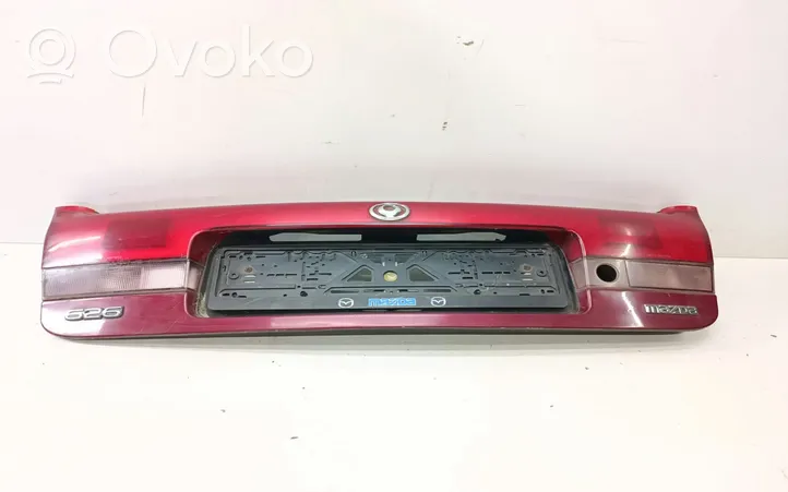 Mazda 626 Copertura striscia fanale posteriore/targa 0431394