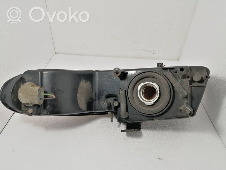 Chrysler Voyager Lampa przednia 04576313AD