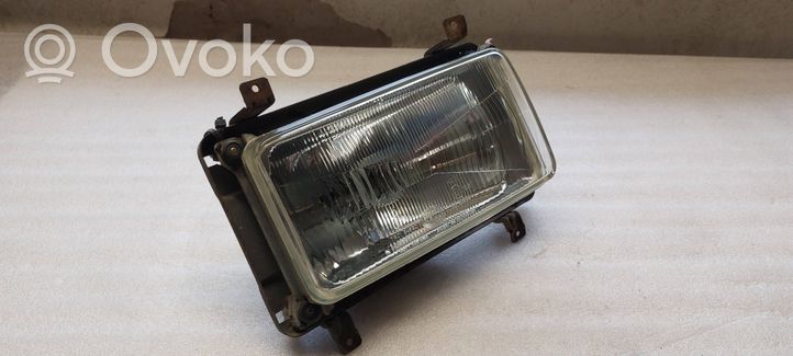 Volkswagen I LT Lampa przednia 001130608