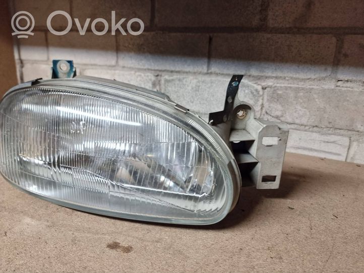 Mazda 121 Lampa przednia 0014095