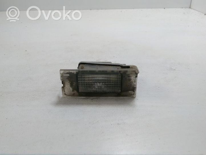 Renault Megane II Lampa oświetlenia tylnej tablicy rejestracyjnej 7700796163