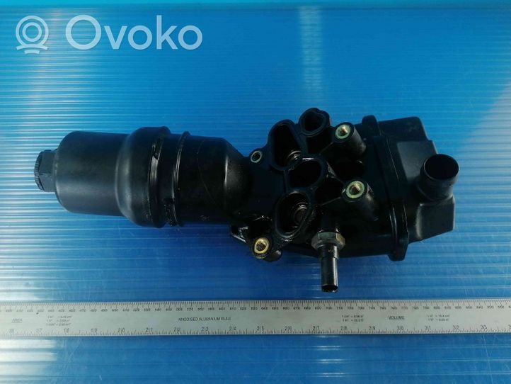 Volkswagen Golf V Supporto di montaggio del filtro dell’olio 06F115397F