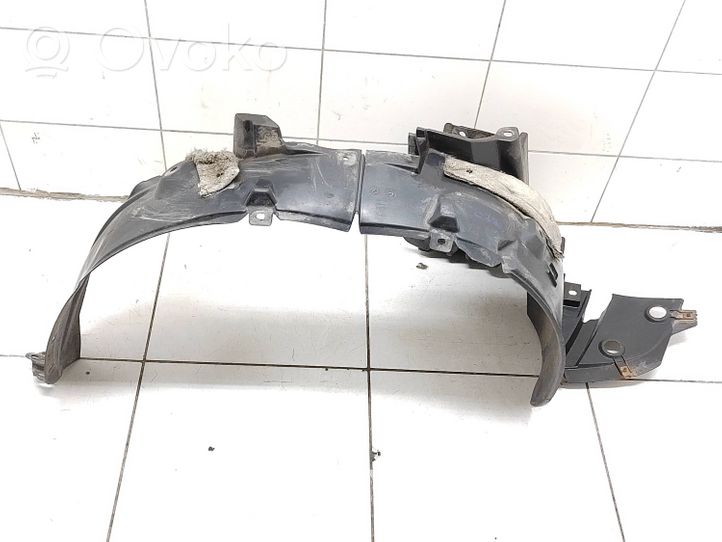 Nissan Note (E11) Pare-boue passage de roue avant 638429U000