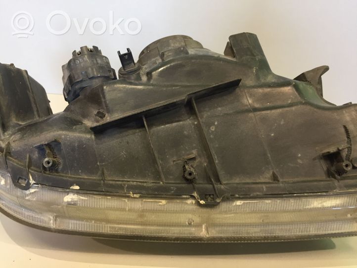 Mitsubishi Pajero Sport I Lampa przednia 10087415