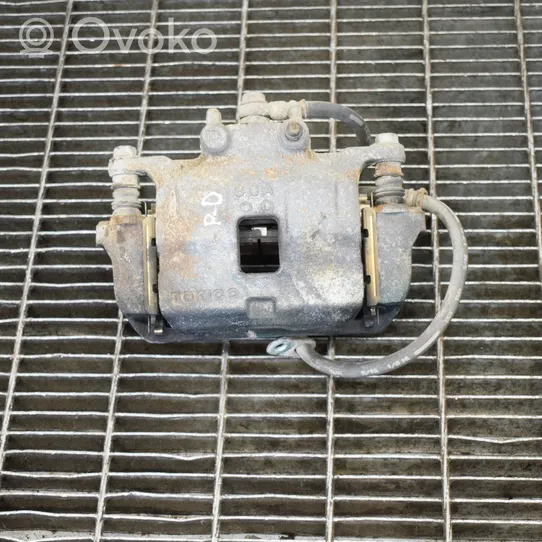 Mitsubishi L200 Caliper de freno delantero 