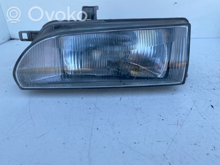 Toyota Corolla E90 Lampa przednia 201653B