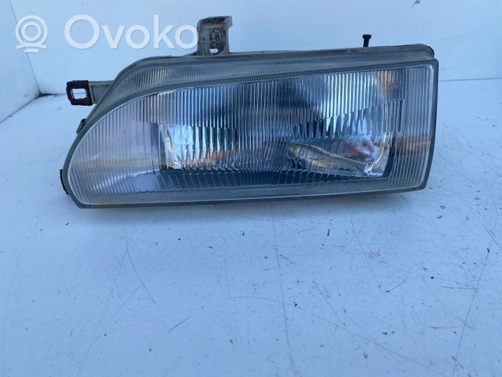 Toyota Corolla E90 Lampa przednia 082121140