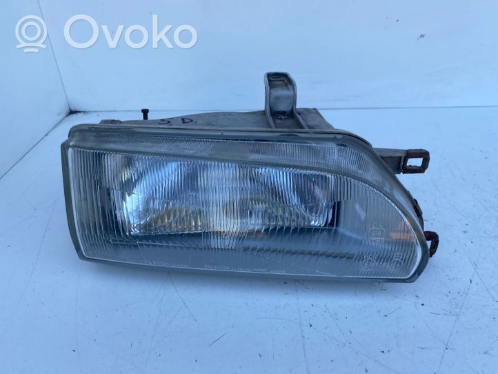 Toyota Corolla E90 Lampa przednia 12307